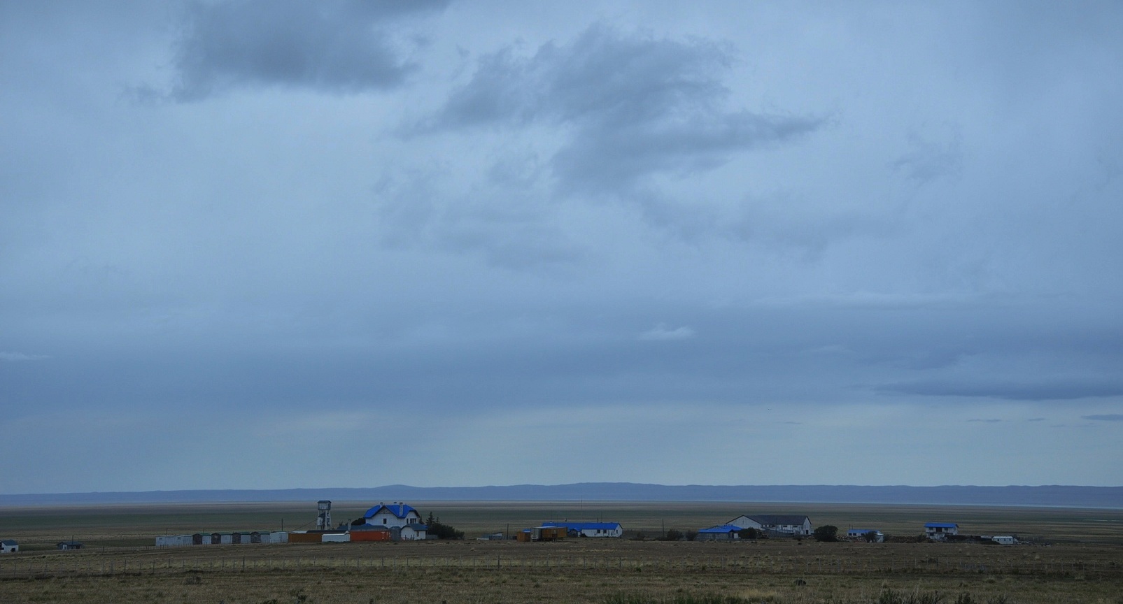 An estancia (large ranch) in the Comune of Laguna Blanca (Patagonia, Chile), just south of Villa Tehuelches, with the Laguna Blanca in the distance (= the lake on the right, faintly visible).
